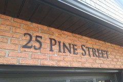 address-sign-3d-letters-on-brick